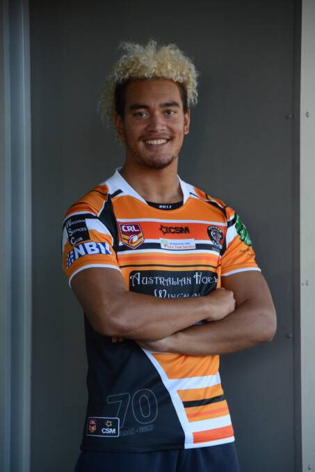 New Zealand import Marlon Purcell models Wingham's 70th anniversary jumper to be worn this season. The Tigers play at home for the first time this year on Sunday.