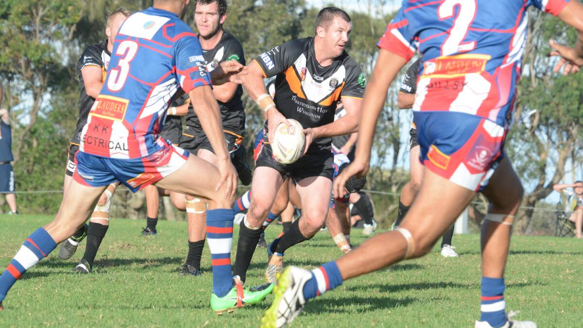 Wingham halfback Trent Green offloads in traffic in the first round clash against Old Bar. He returns to the Wingham team for Saturday's clash against the Pirates at Wingham. 