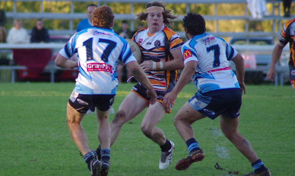 TRAPPED: Wingham second rower Michael Rees confronts the Port City defence. Photo Tanya Atkins