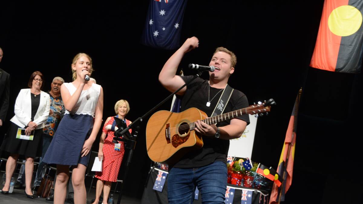 Taree based musician Jake Davey has a busy life performing around the Manning, Newcastle and now Sydney, having recently signed with a Sydney agency. He is pictured on stage at the Taree Australia Day ceremony.
