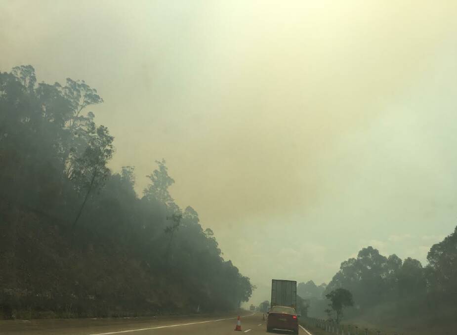 Smoke on the Pacific Highway around 1.30pm Saturday, November 5. The highway was closed for periods of time over the weekend causing traffic delays. 