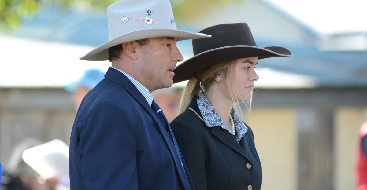 Learning on the job: Beef Week main judge Ben Toll converses with Wingham High's Brooke Anderson while judging beef cattle at Beef Week 2016. Photo: Scott Calvin