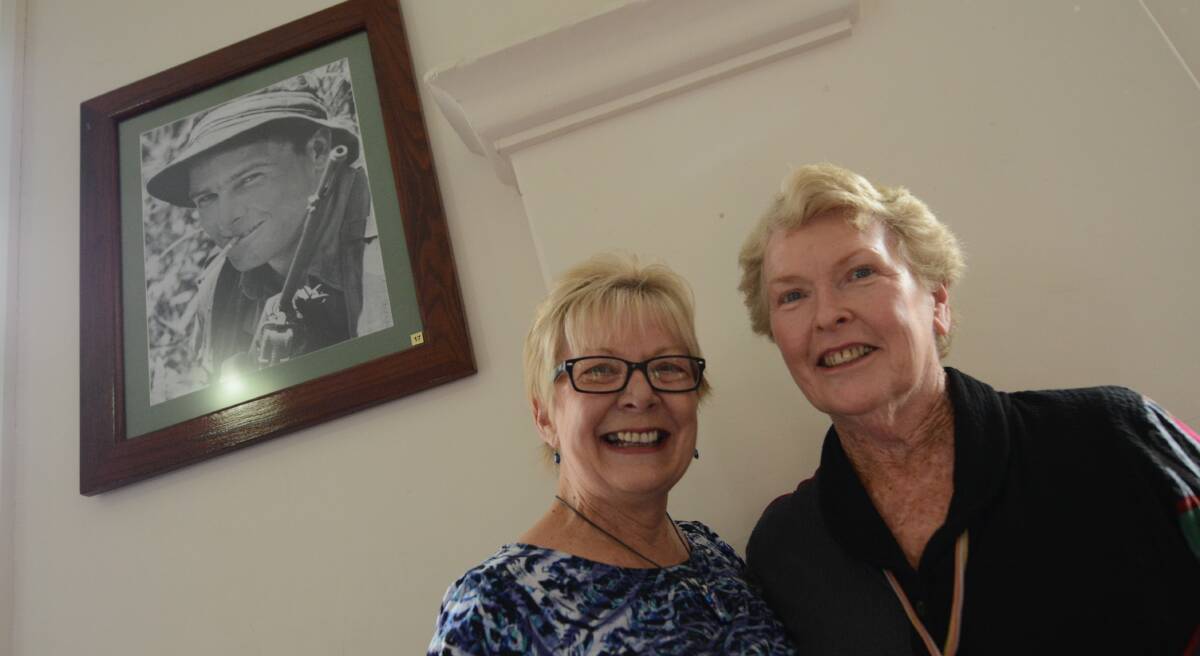The photo of Private Harry Summerville smiles down to the delight of his widow, Lesley and cousin Barbara Waters at the Wingham Town Hall.