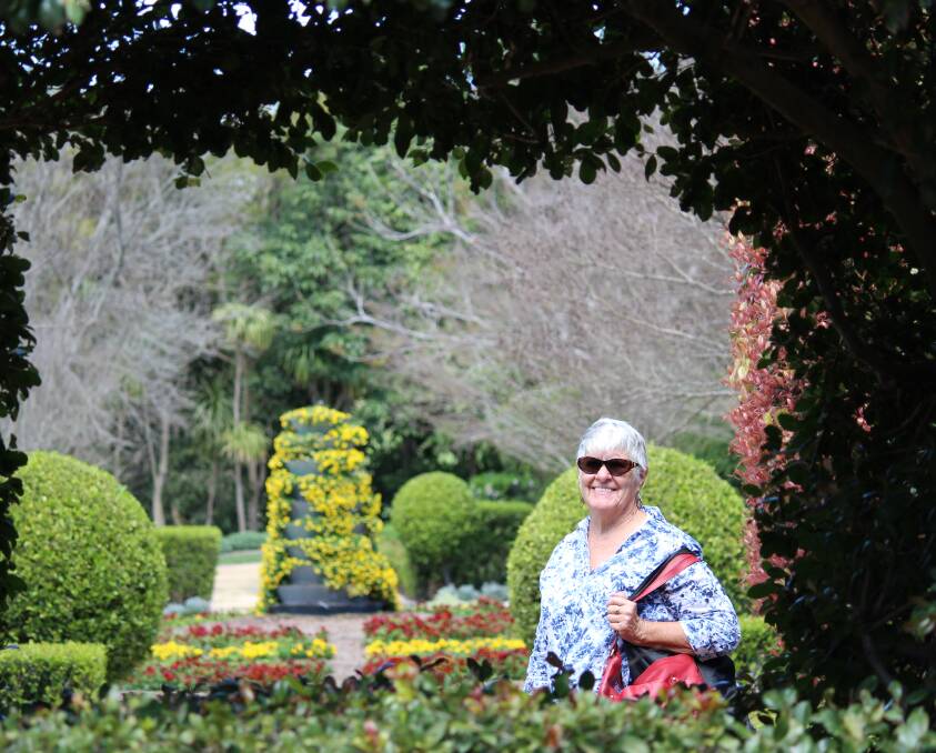 Ashlea Town and Country Garden Club could spend all day at the the Hunter Valley Gardens. Pictured is  Margaret Duncan looking through to the Indian Mosaic garden.
