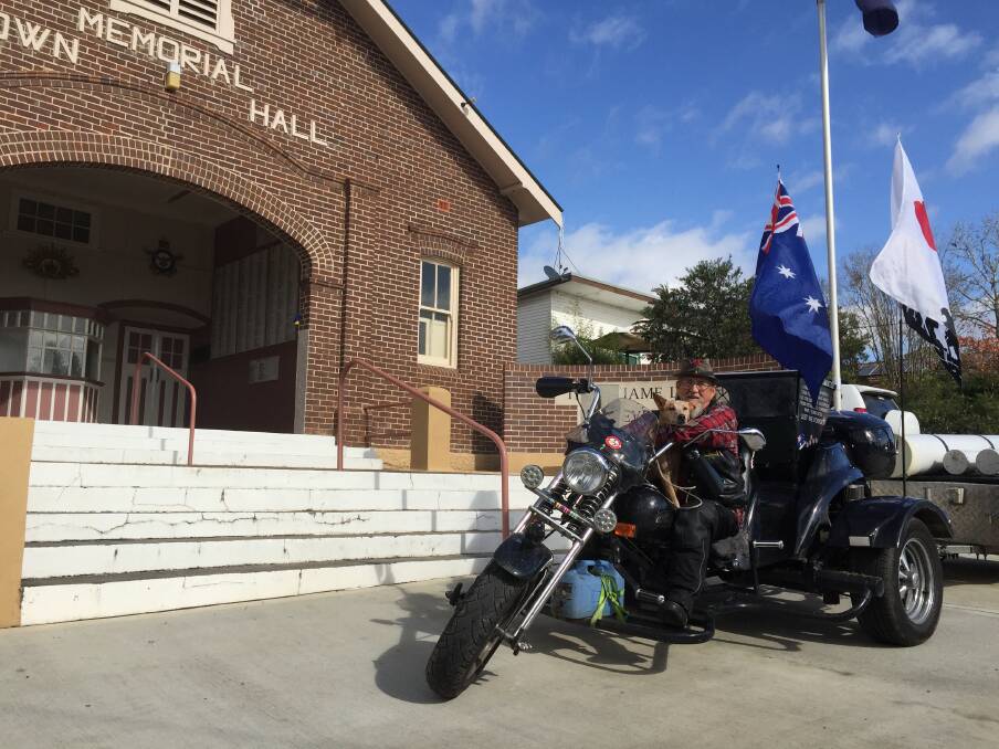 Rob Eade and Ginge on the trike that has so far taken them 19,000 km around Australia remembering the fallen.