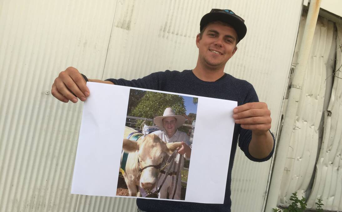 Where are they now: Ex Wingham High School ag student Karl Burton with the photo that saw him dubbed the Beef Week boy.