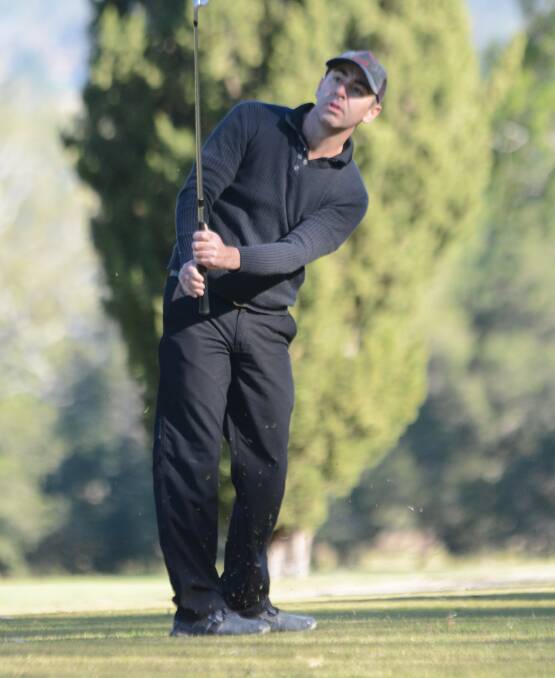 Paul Muir watches the result of a fairway shot during a round at Wingham Golf Club.