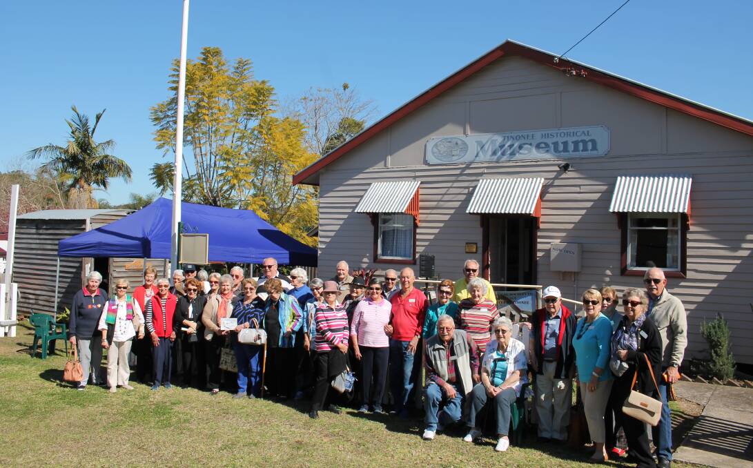 Reaching into the past: Forster Probus Club members enjoy morning tea and a day of discovery at Tinonee Historical Museum, the old gaol and former police stables.