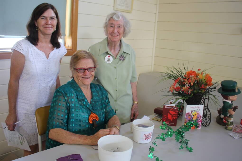 Two celebrations: From left, Maria Watts of Sydney, with her mum Bev Clancy, whose birthday is on St. Patrick’s Day, and Tinonee Red Cross member Anne Gribble.
