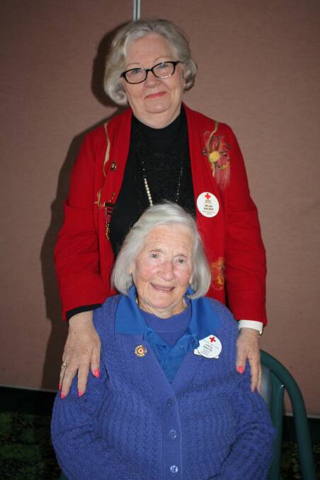 Wingham Red Cross patrons Mrs Helen Walker (standing) and Mrs Joyce Martin, at the AGM.