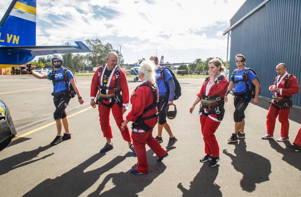 MERCURY NEWS Photo shows participants in the Guiness Book of world records most Santas sky diving. Landing at Dalton Park in North Wollongong. Photo by Georgia Matts 17/12/2016