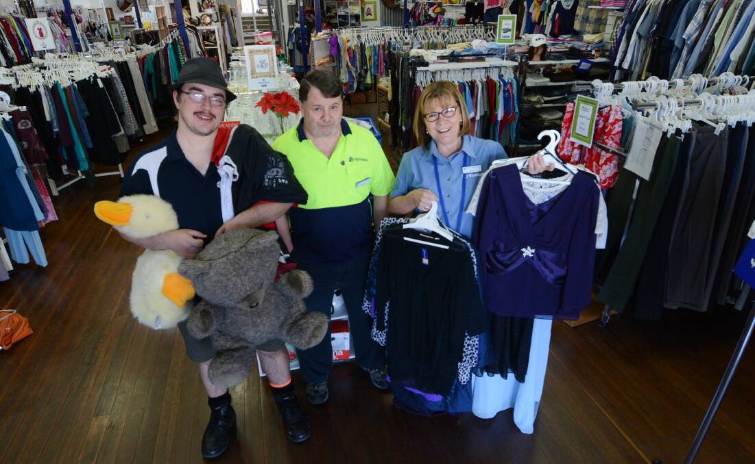 Vinnies Taree president and store manager Tony Pettit (centre) says about 40 per cent of donations to the Pulteney Street store are unusable and have to be taken to the tip.