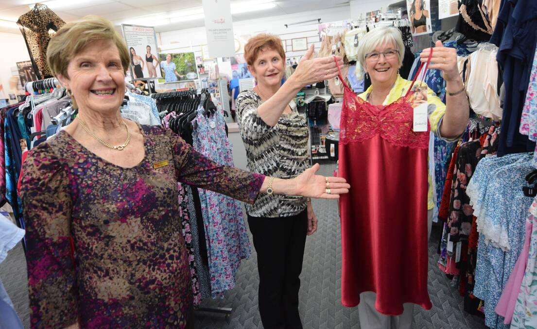 Margaret George and Julie Northam of Margaret's Underfashions in Taree work with Carolyn Erickson to try to decide what lovely lingerie will feature at the Quota fashion parade on October 8.