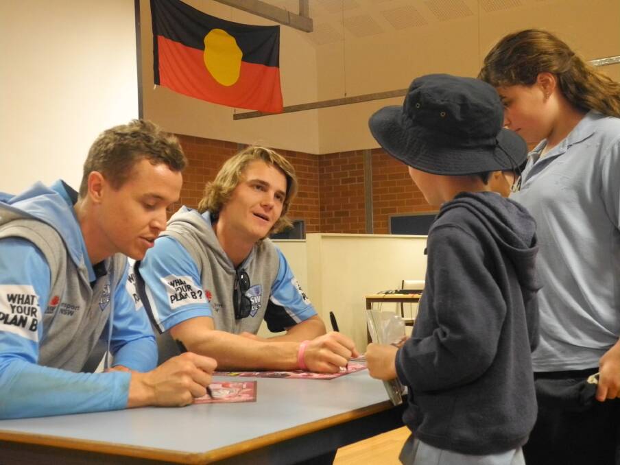 Cricket heroes: Cricket NSW Blues squad members Nick Larkin and Henry Thornton were a hit with the students at Wingham Brush Public School. Photo: Julia Driscoll