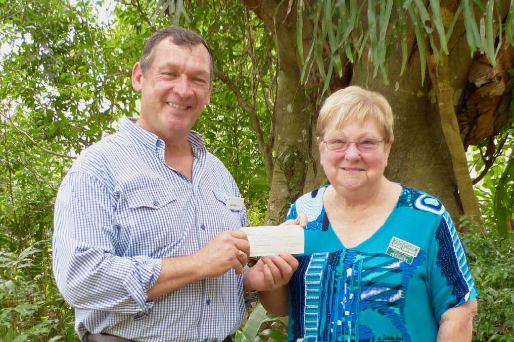 George Hoad with South West Rocks Garden Club president Margaret Harris-Walker presenting him with a cheque for $1000 for Ronald McDonald House.
