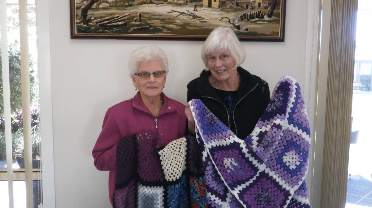 Home comforts: Kathleen Thomas and Vera Fieldhouse have been crocheting for two years to donate home-made blankets to patients in the rehabilitation wing of Wingham Community Hospital. Photo: supplied.