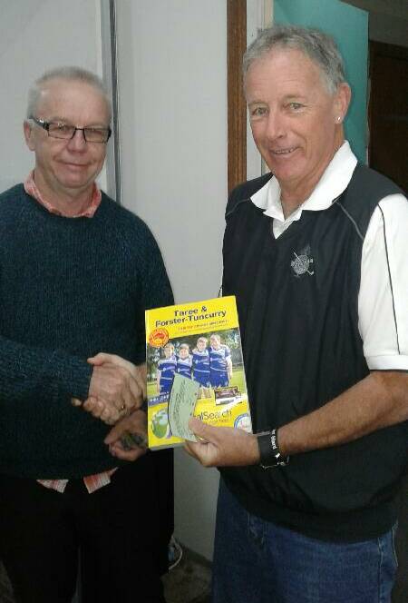 Wingham Golf Club secretary manager Gary Considine won the Thursday Chook Run. Club captain Neville Blanch presented Gary with his 'prize' - a copy of the yellow pages.