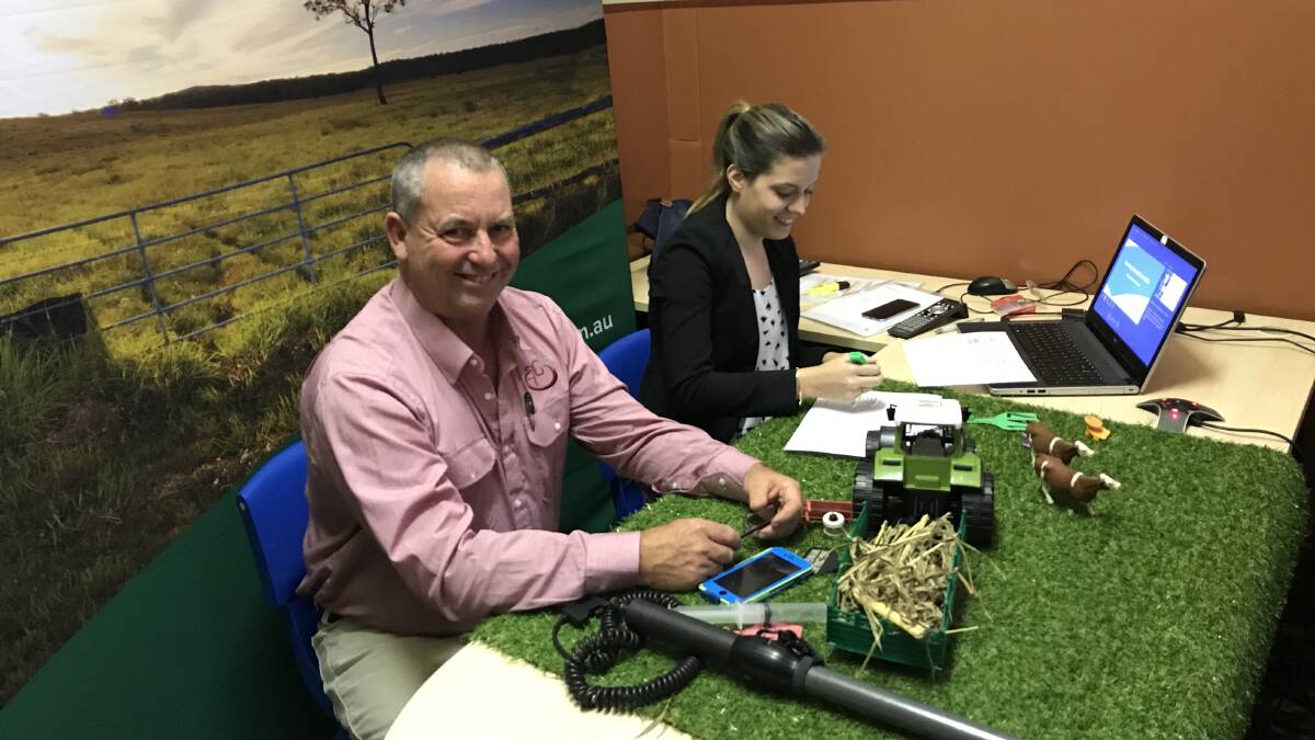 Playing with props: Linga Longa farmer Greg Newell in the virtual classroom in the Australian Museum with a school teacher. Photo: Fiona Young, Meat and Livestock Australia.