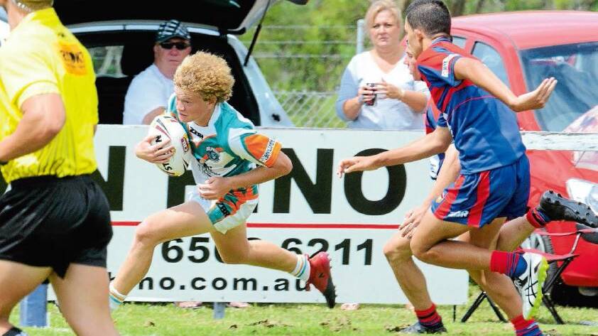 East Coast under 16 winger Jamaine Anderson from Wauchope races in for one of his two tries against Newcastle.