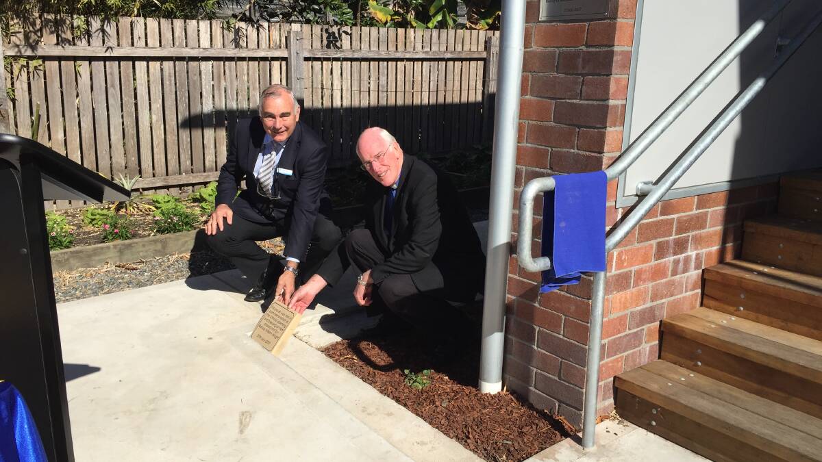 Foundation brick: Director of Catholic schools Dr Michael Slattery and Newcastle-Maitland Diocese Bishop Bill Wright lay the first of the P&F fundraising pavers at St Joseph's Primary School, Wingham. Photo: Julia Driscoll
