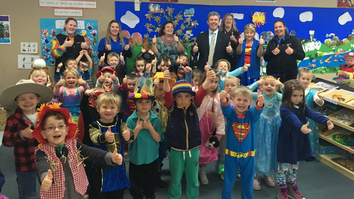 Thumbs up: Wingham and District Preschool staff and students and Federal Member for Lyne Dr David Gillespie are celebrating a major grant win for the preschool.