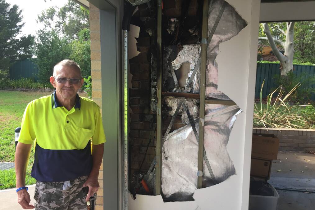 Interior damage: Resident Cameron Holland shows the damage that occurred in the interior of the garage as a result of the fire. Photo: Julia Driscoll.