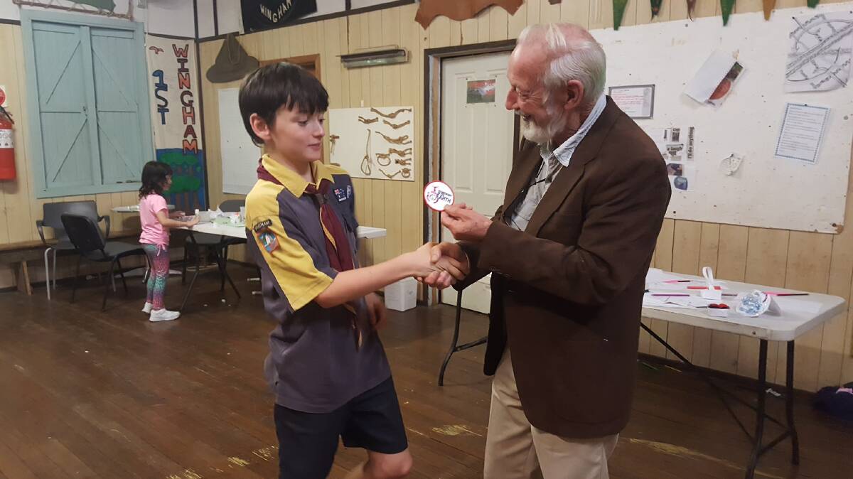 First ever: Cub scout Rory Byrne being presented with the first Symphony of the Earth badge. Photo: supplied