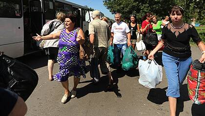 Residents flee fighting in eastern Ukraine.