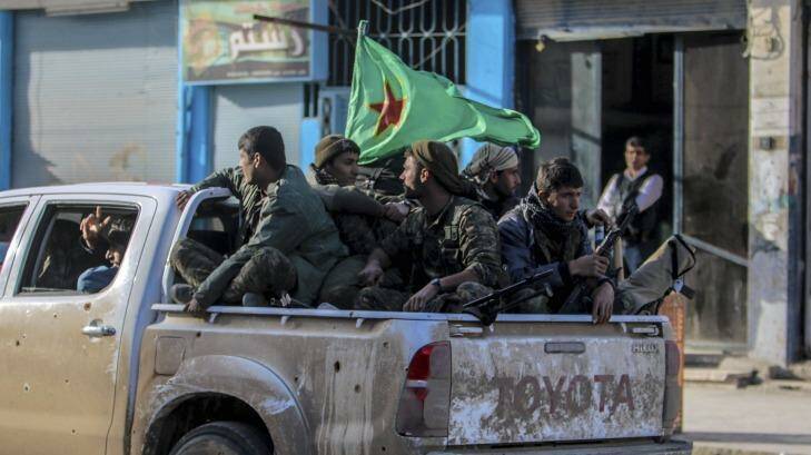 Fighters of the Kurdish People's Protection Units (YPG) in the Syrian Kurdish city of Qamishli. Photo: STRINGER