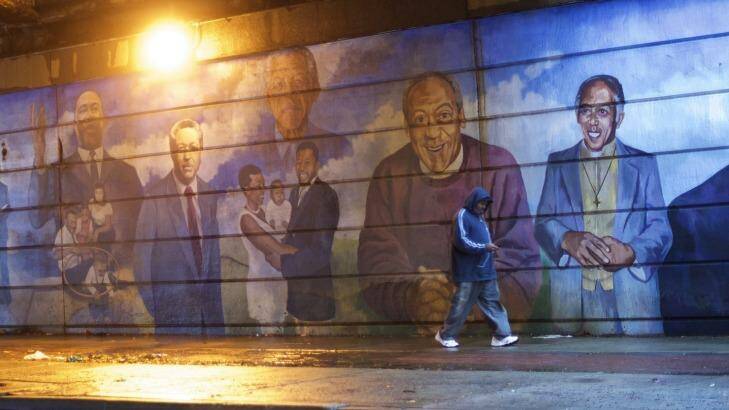 A mural in Bill Cosby's native Philadelphia shows the comedian alongside South African leader Nelson Mandela and Martin Luther King jnr. In his Baltimore show, Cosby referenced his connection with the late Mandela. Photo: New York Times
