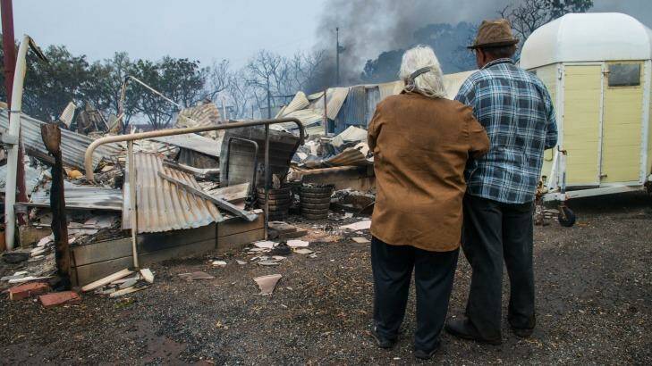 Property owners Jim and Lorraine inspect their destroyed house near the South Australian town of Roseworthy. Photo: Brenton Edwards