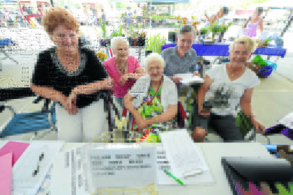 Lyn Mayo OAM, Pam Missio, Nita Reed, Dr David Keegan and Patti Hogan worked together to secure signatures at last weekend's Hub Markets for a petition to keep the Nita Reed Community Dialysis Centre open in Taree.