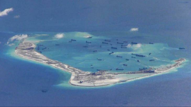 Chinese dredging vessels are purportedly seen in the waters around Mischief Reef in the disputed Spratly Islands in the South China Sea. Photo: US Navy