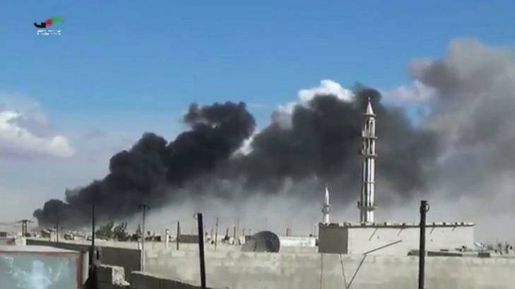 Smoke rises after airstrikes by military jets in Talbiseh in the Homs province, western Syria after Russian military jets carried out airstrikes for the first time. Photo: Homs Media Centre/AP