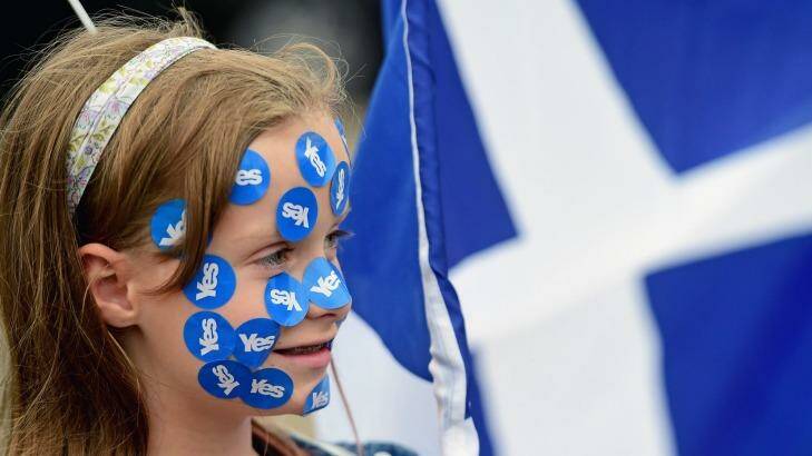 Scotland's future ... A young girl has yes stickers placed on her face in George Square, just a few hours before polling stations will close in the Scottish independence referendum in Glasgow, Scotland. Photo: Jeff J Mitchell/Getty Images