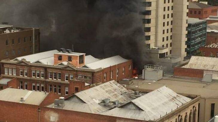 Buildings in the centre of Adelaide were ablaze on Tuesday, threatening a large hotel and forcing the evacuation of hundreds of people from the area. Photo: Nine News Adelaide