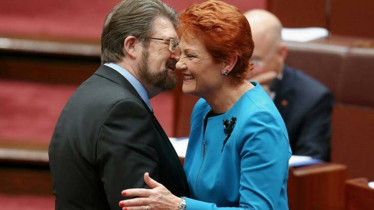 Senator Pauline Hanson is congratulated by Senator Derryn Hinch after delivering her first speech in the Senate last month. Photo: Alex Ellinghausen