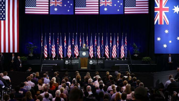 Waving the flags: The audience repeatedly applauded President Obama.  Photo: Alex Ellinghausen