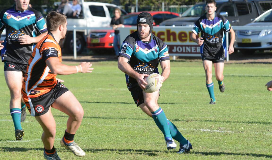 Taree City five-eighth Todd Bridge looks for a gap in the Wingham defence during a match in the 2015 Group Three season. The group will have a longer season in 2016.