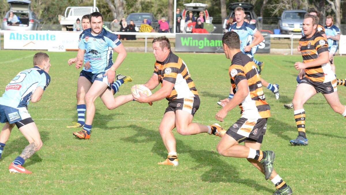 Wingham five-eighth Mitch Steel makes a break during the Group Three Rugby League game against Port City at Wingham. Port City won 36-16.
