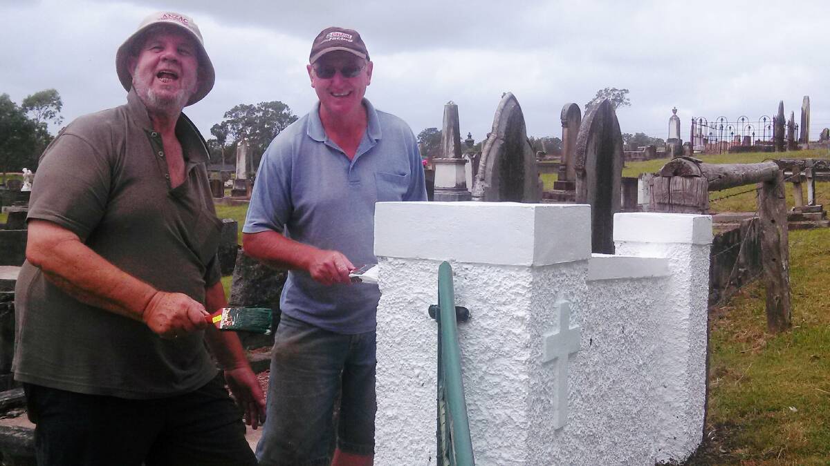 Wingham RSL Sub Branch president Ron Irwin and Ted Bowen getting reach to spruce up the gates to the Wingham Cemetery