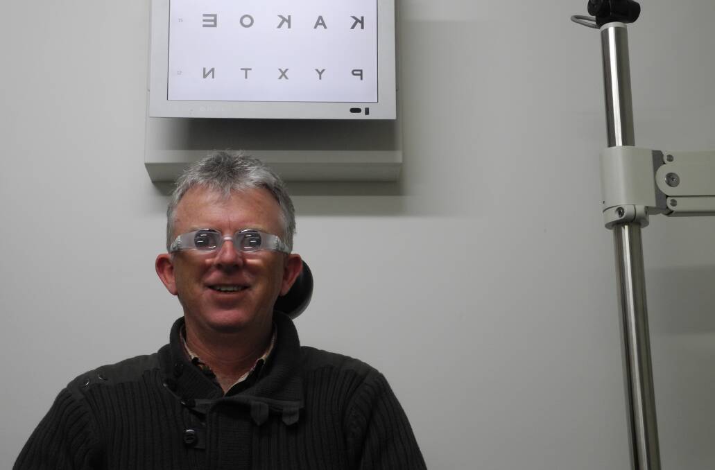 Wingham Eyecare's Optometrist Dennis Smith tries on a special pair of magnifying glasses