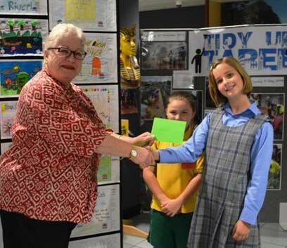Acting Mayor Councillor Robyn Jenkins and Hayley Kluin from Tinonee Public School with Lakita O’Connor in background.