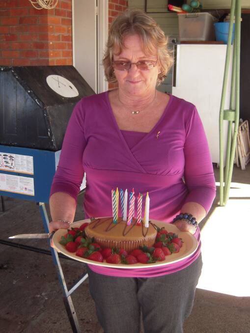 Birthday girl Carol McGann with her cake