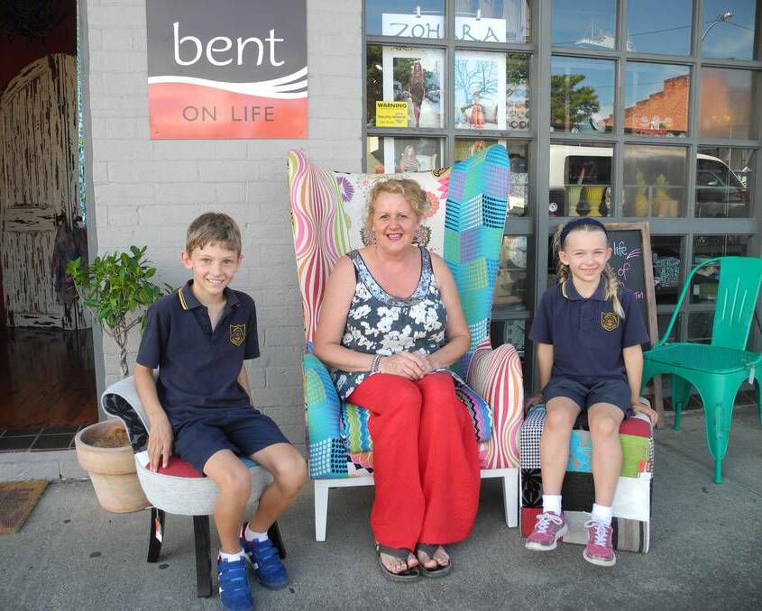 Bent on Life manager Wendy Brown brightens up the street and is joined by passing school children for a friendly chat during the trial of Vibrant Spaces.