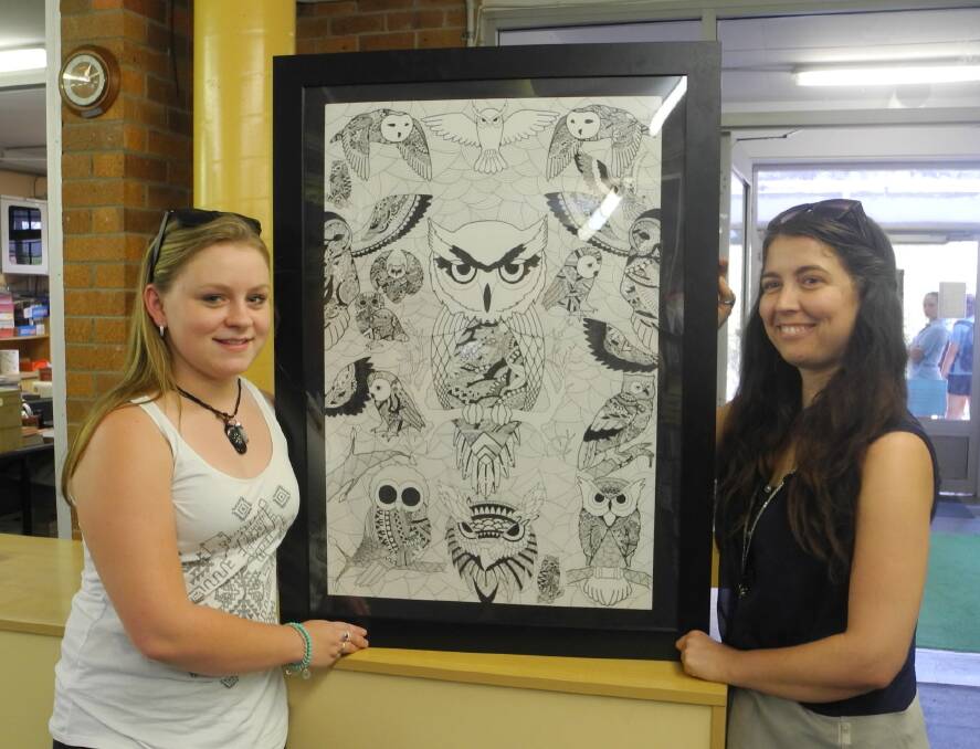 Artist Teleah Hodges and art teacher Peta Tattersal, with Teleah’s work “With Darkness Comes Wisdom”