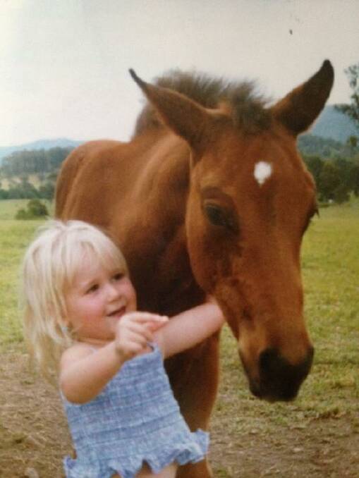 Teenager Emily Forster pictured as a young child with 'Feather' the horse she will now ride in the Appaloosa Nationals