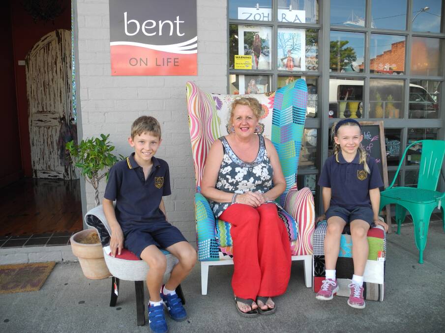 Bent on Life manager Wendy Brown brightens up the street and is joined by passing school children for a friendly chat.