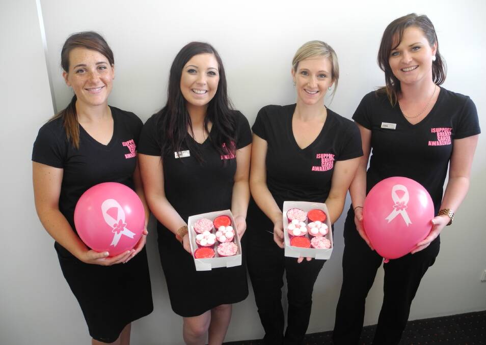 From left to right LJ Hooker Wingham's Rachael Birkefield, Brittany Pulvirenti, Jacinta Palmer and Charmaine Sheather ready to sell pink cupcakes