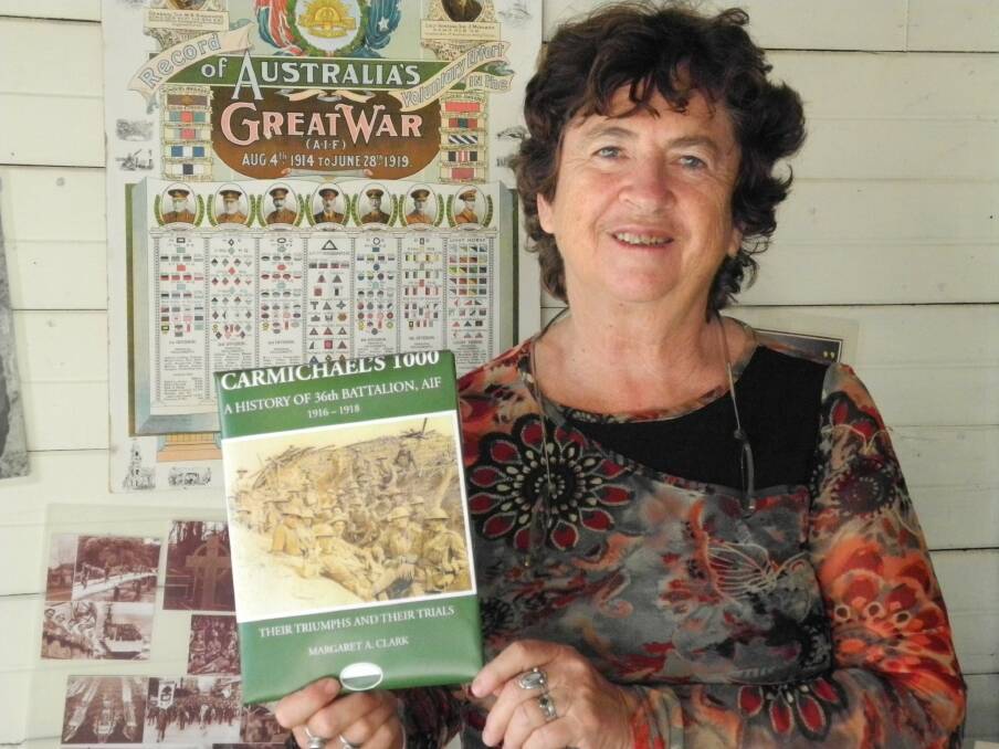 Author Margaret Clark with a 'mock up' copy of her soon to be released new book Carmichael's 1000 